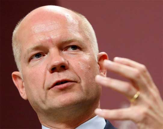 William Hague urged the 'discredited' Syrian regime to end its violent repression