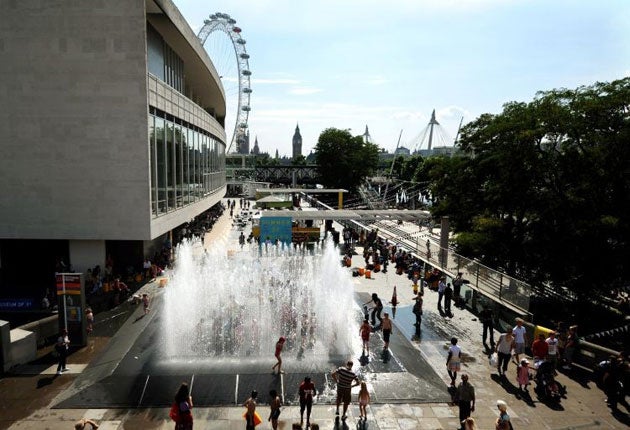 Children play in the fountains outside the British Film Institute on the South Bank yesterday