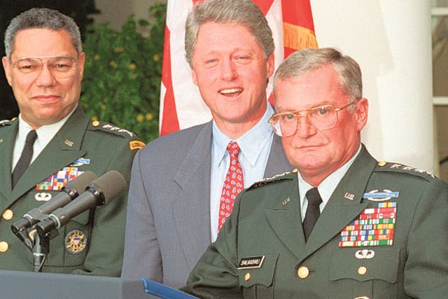 Shalikashvili (right) with Colin Powell and President Clinton in the White House Rose Garden in 1993