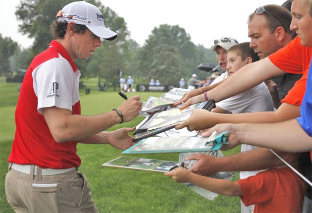 Rory McIlroy signs autographs during practice at the Bridgestone Invitational yesterday