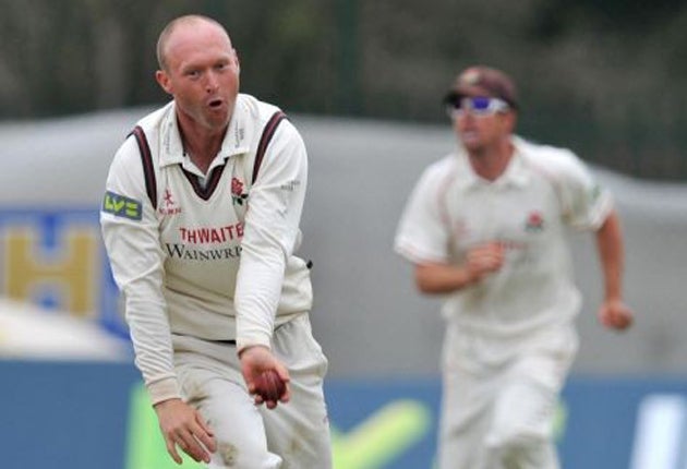 Lancashire's leftarm spinner Gary Keedy, left, took three wickets in fourth-day conditions to his liking but could not remove the
Bears' defiant Tim Ambrose