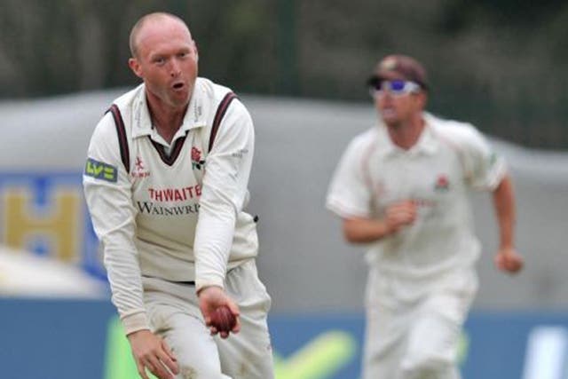 Lancashire's leftarm spinner Gary Keedy, left, took three wickets in fourth-day conditions to his liking but could not remove the
Bears' defiant Tim Ambrose