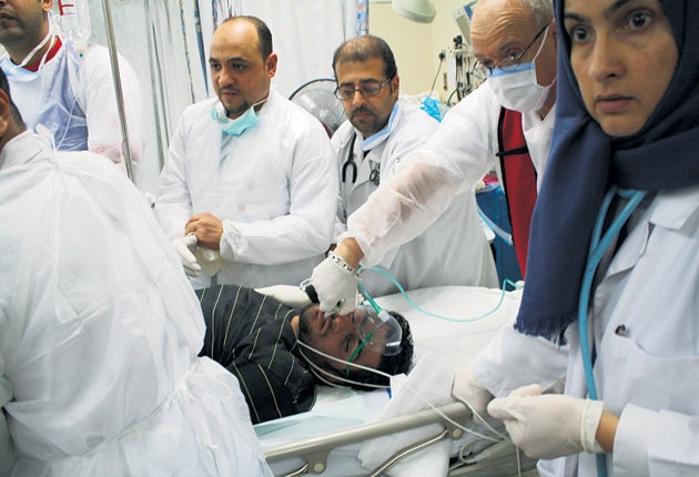 Staff at Salmaniya hospital claim injured protesters have been
beaten by government forces