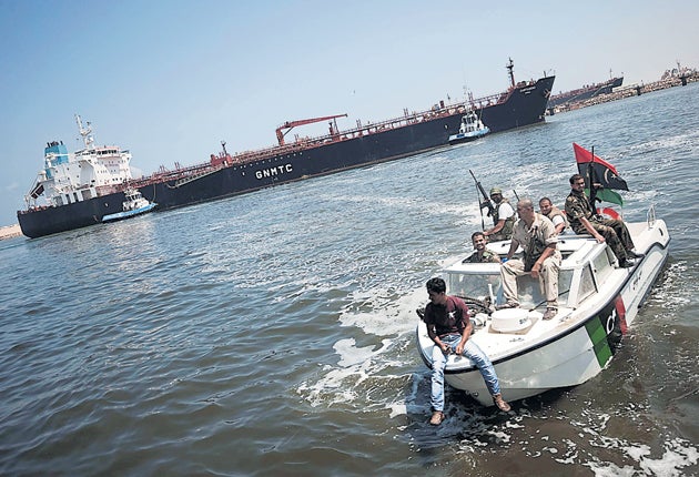 Rebels escort the tanker Cartagena yesterday, which was on its way to Tripoli