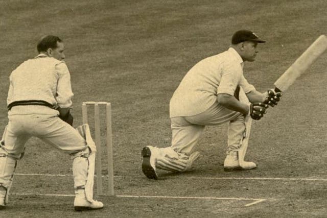 Watkins (right) on his way to a century for Glamorgan in 1949, watched by Surrey's Arthur McIntyre