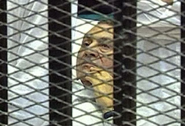 Hosni Mubarak faced his accusers this week from a hospital bed behind a cage
