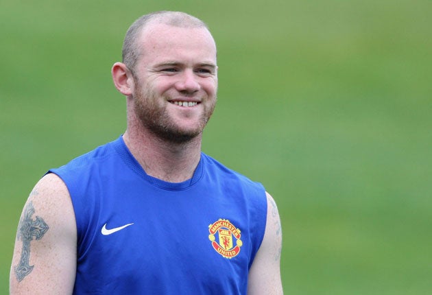 Wayne Rooney trains ahead of the start of the new campaign