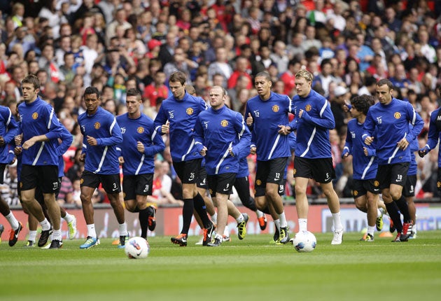 Manchester United hold an open training session in front of 12,000 fans at Old Trafford yesterday