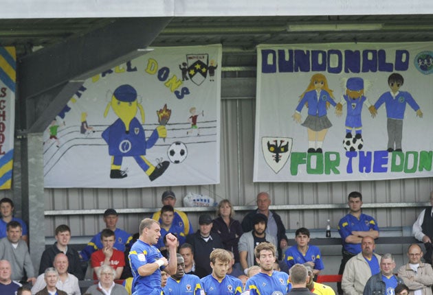 Signs of progress: AFC Dons have a strong connection with their fans, as shown by these children's pictures adorning Kingsmeadow