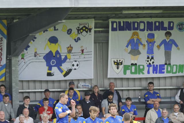 Signs of progress: AFC Dons have a strong connection with their fans, as shown by these children's pictures adorning Kingsmeadow