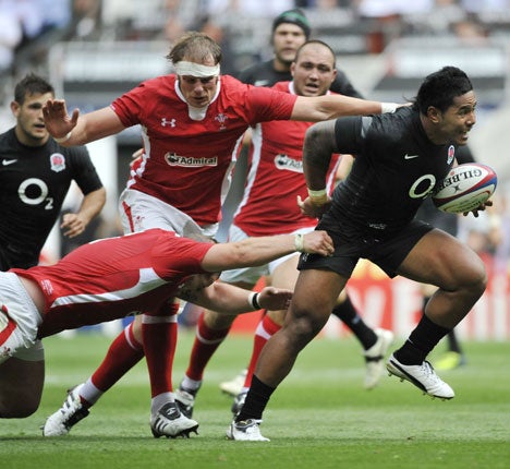 Manu Tuilagi bursts through the Wales defence on Saturday to score a try on his England debut