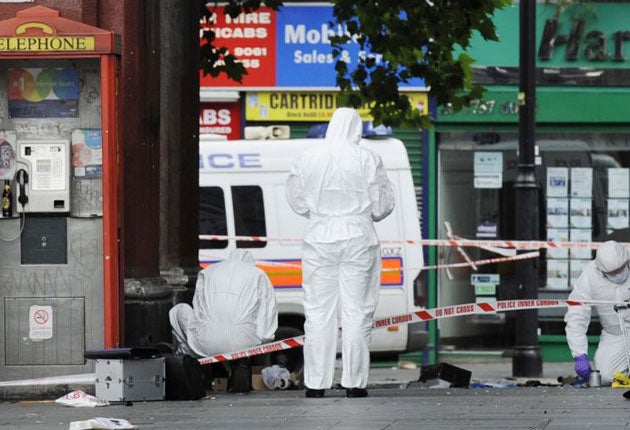Police forensic experts at work in Brixton