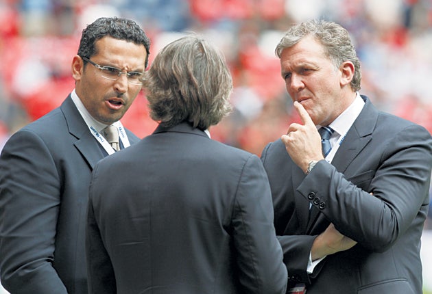 City chairman Khaldoon al-Mubarak (left) and Garry Cook, the chief executive, talk to Roberto Mancini at Wembley