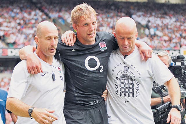 Lewis Moody is helped from the field during England's win over Wales