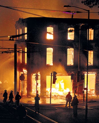 A property burns near Reeves Corner, Croydon, during the riots