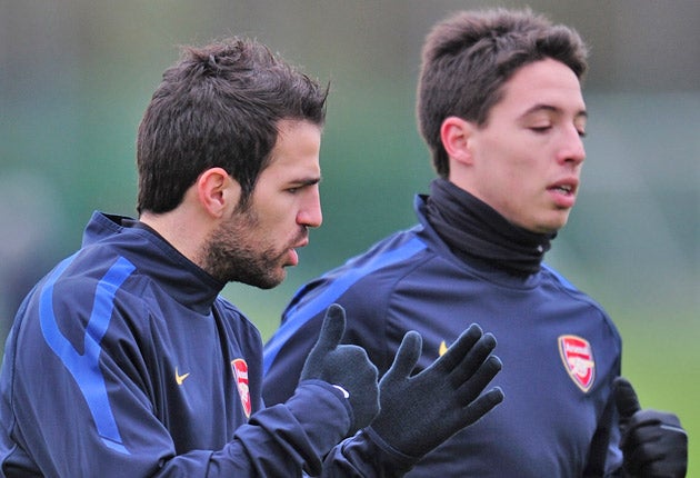 Marouane Chamakh fears Samir Nasri (right) and Cesc Fabregas will leave