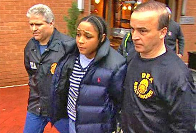 Agents escort Felicia 'Snoop' Pearson after her arrest in March in Baltimore