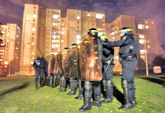 French police hold the line during a clash with rioters in Corbeil-Essonnes, Paris, in November 2005