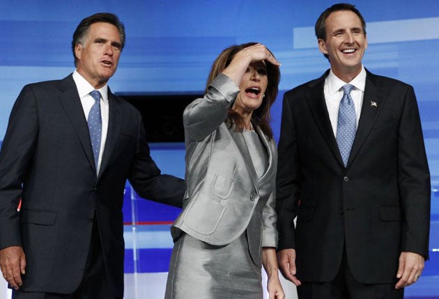 Republican presidential candidates Mitt Romney (L), Michele Bachman (C) and Tim Pawlenty