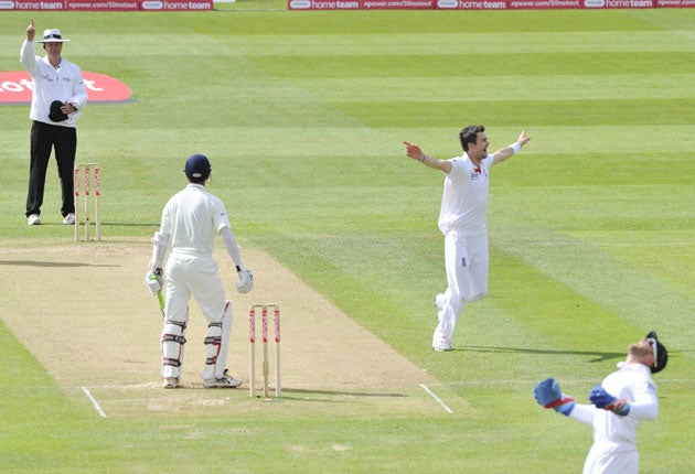 James Anderson celebrates after Matt Prior catches Rahul Dravid to give him his third wicket of the innings and draw level with Sir Alec Bedser on the all-time England list