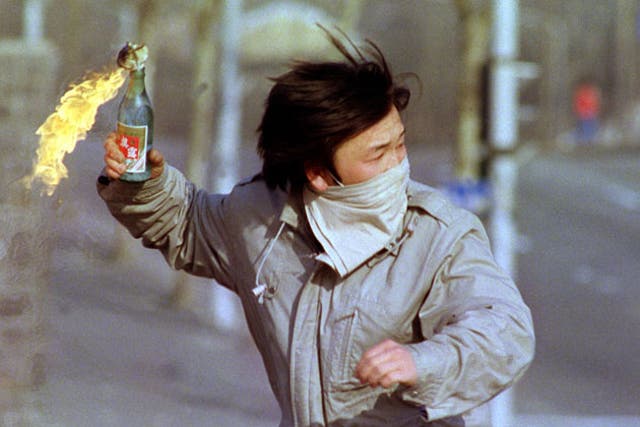 A student throws a petrol bomb in Seoul in 1988