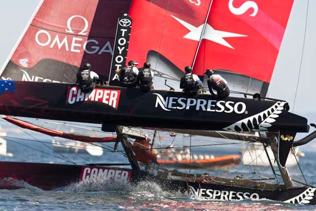 Flying high, Dean Barker's Emirates Team New Zealand on its way to winning the inaugural America's Cup World Series regatta in Cascais, Portugal