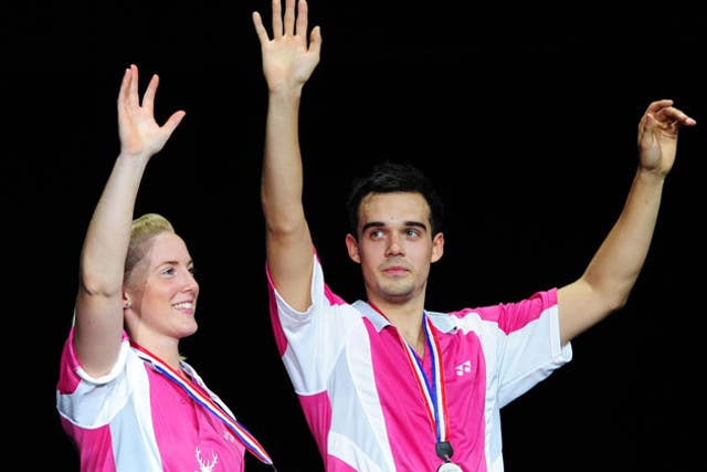 Chris Adcock and Imogen Bankier celebrate their silver medals at the world championships