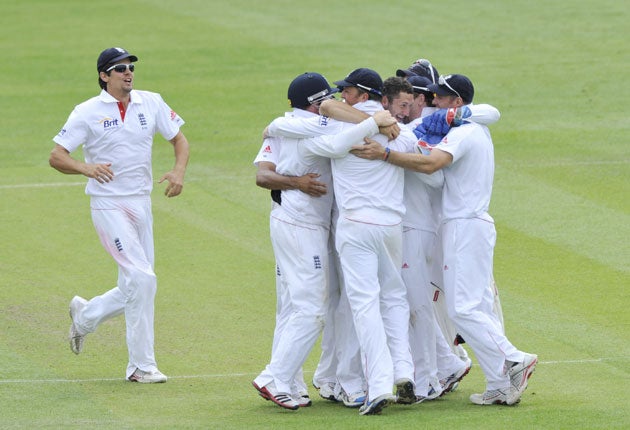 Tim Bresnan is hugged after taking the final wicket to confirm England's place at the top of the pile