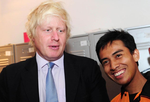 Boris Johnson with Ashraf Rossli who was mugged during the riots