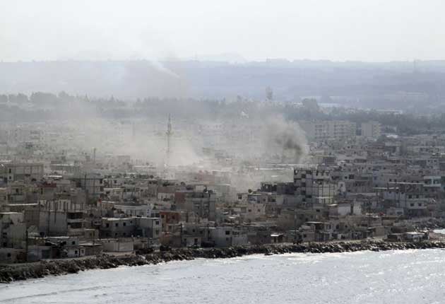 Syrian tanks and navy ships shelled the main Mediterranean port city of Latakia yesterday