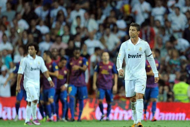Ronaldo looks frustrated as Barcelona celebrate