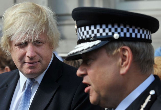 Boris Johnson (left) and acting commisioner of the British Metropolitan Police Tim Godwin