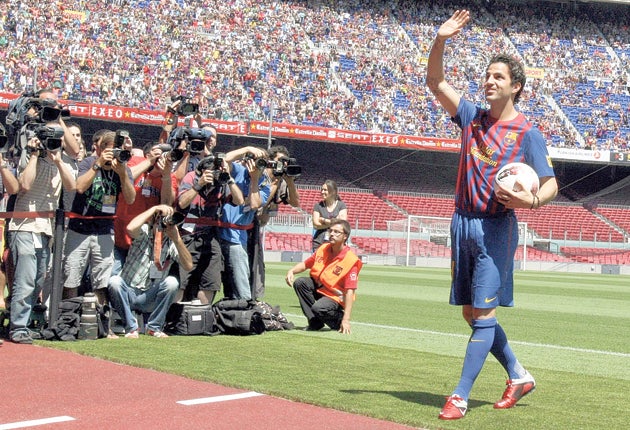 Cesc Fabregas waves to the crowd during his presentation at the Nou Camp yesterday