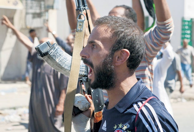 Fighters in Zawiyah celebrate rebel advances