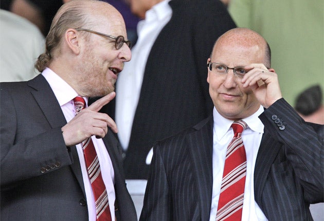 Manchester United directors Avram, left, and Joel Glazer