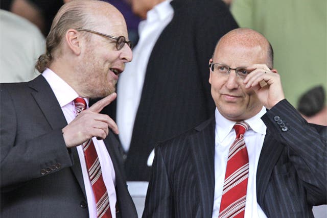 Manchester United directors Avram, left, and Joel Glazer