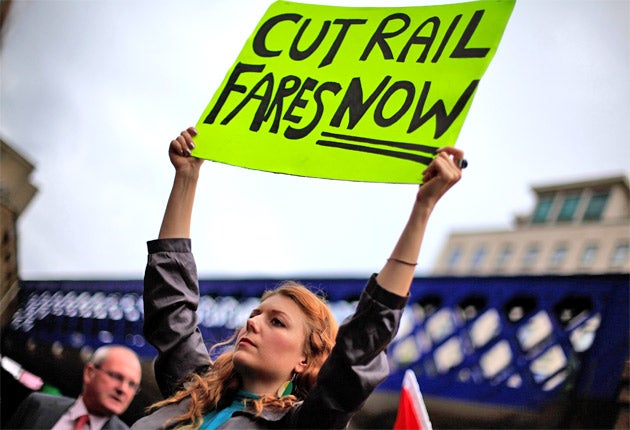 A demonstrator outside Waterloo Station in London yesterday