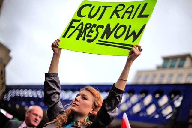 A demonstrator outside Waterloo Station in London yesterday