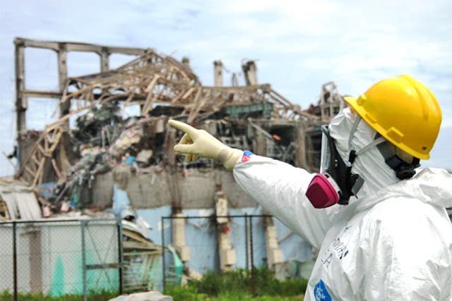 International Atomic Energy Agency fact-finding team leader Mike Weightman inspects the damage to the Fukushima Daiichi nuclear power station in May, 11 weeks into the disaster