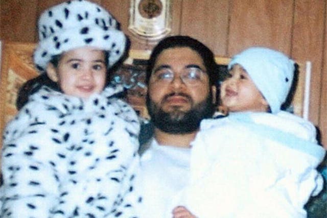 Shaker Aamer holding his daughter Johninh and his son Michael