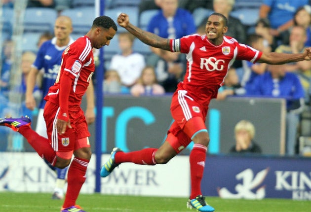 Bristol City's Nicky Maynard (left) celebrates scoring his first goal last night