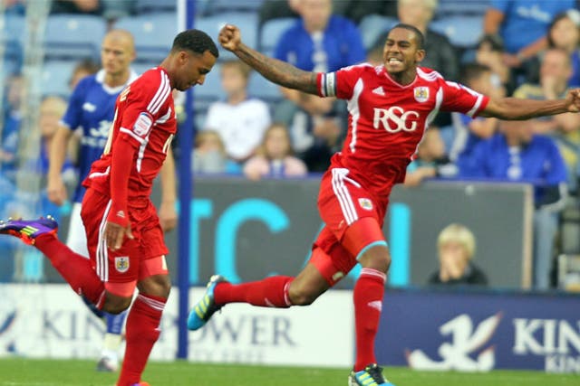 Bristol City's Nicky Maynard (left) celebrates scoring his first goal last night
