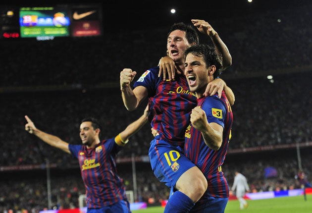 Goal-scorer Lionel Messi (No 10) celebrates with new Barcelona signing Cesc Fabregas