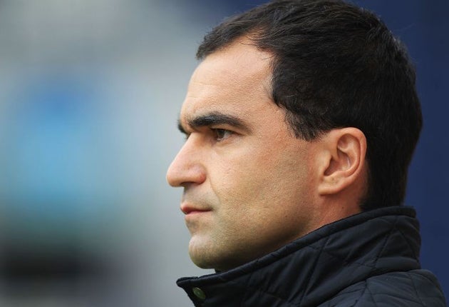 The Wigan manager, Roberto Martinez, is relaxed about returning to Swansea tomorrow