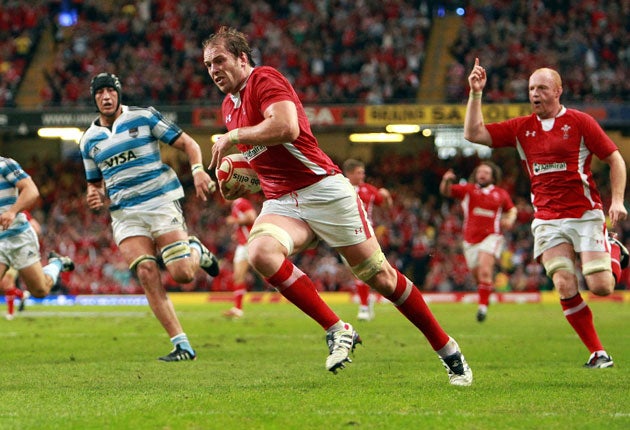 The Welsh lock Alun Wyn Jones heads for the tryline to score against Argentina
