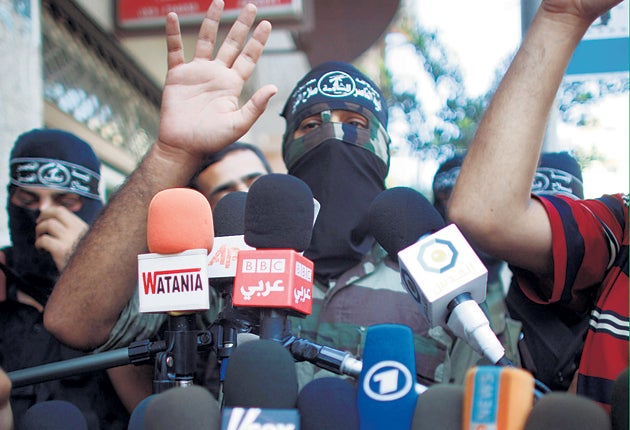 Militants address the media yesterday