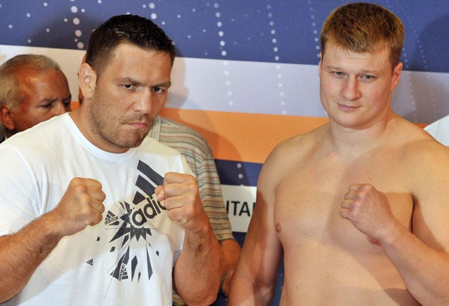 Ruslan Chagaev (left) and Alexander Povetkin at the weigh-in yesterday