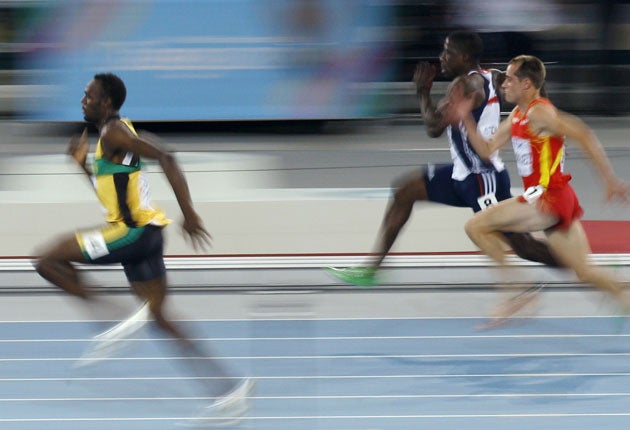 Usain Bolt leaves Britain's Dwain Chambers and Spain's Angel David Rodriguez in his wake in their World Championships first-round 100m heat