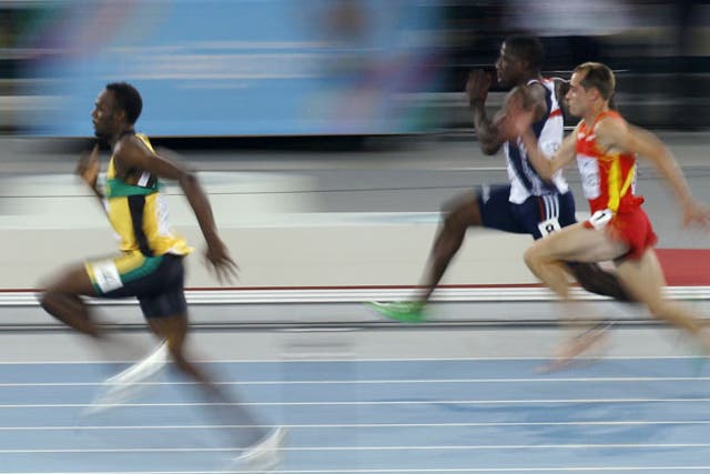 Usain Bolt leaves Britain's Dwain Chambers and Spain's Angel David Rodriguez in his wake in their World Championships first-round 100m heat