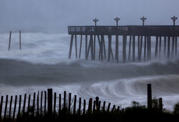 Waves crash into Kitty Hawk Pier as Irene strikes North Carolina